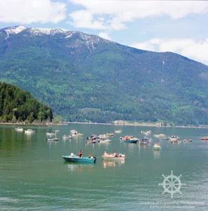 Fishing boats congregating at the Outlet just east of Balfour. The Kootenay Lake ferries had to steer their way through this crowd. Photograph courtesy of the Royal BC Museum.
