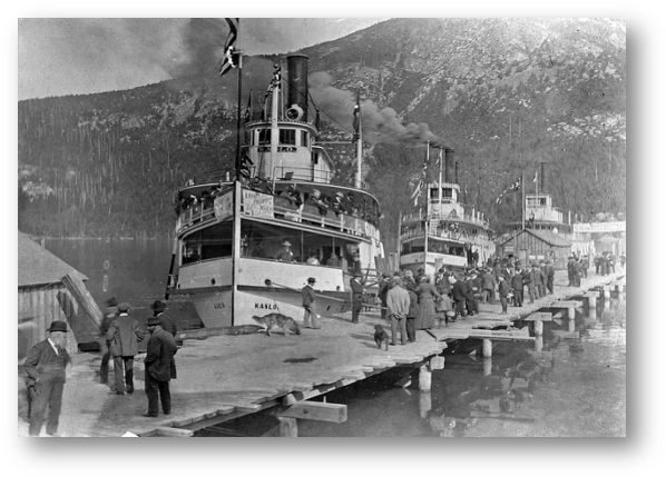 The Kaslo, Kokanee and Moyie at the Nelson city wharf shortly before departure time. The Kaslo and Kokanee were heading to Kaslo while the Moyie was taking excursionists to a different location.